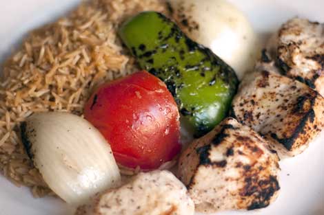 Chicken Kabob - Marinated boneless chicken breast served with pallow and marinated vegetables.